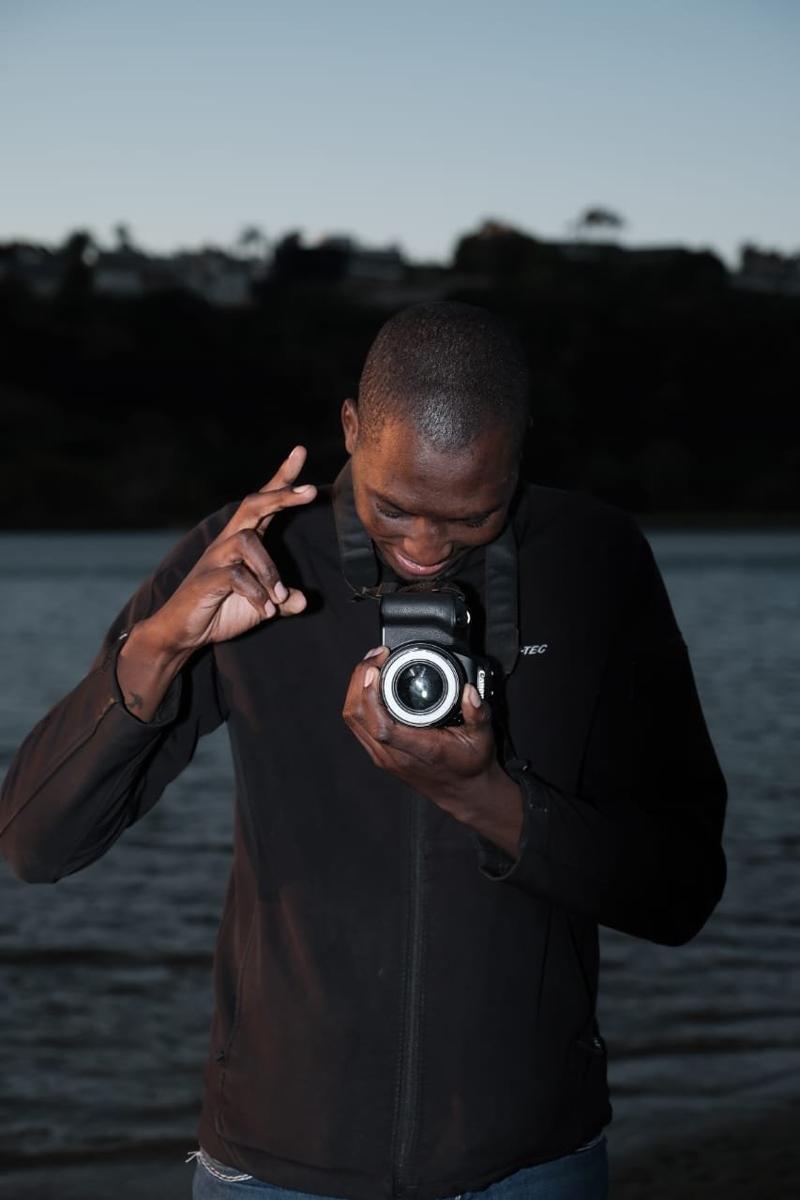 Xabiso Boyce — founder of Inline Media, on location with camera